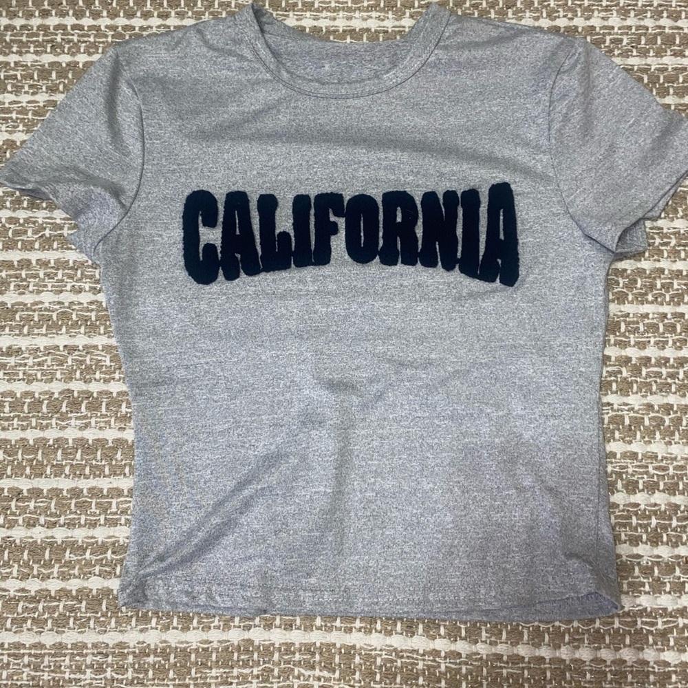 Cute gray crop top with soft lettering on the front never been worn!